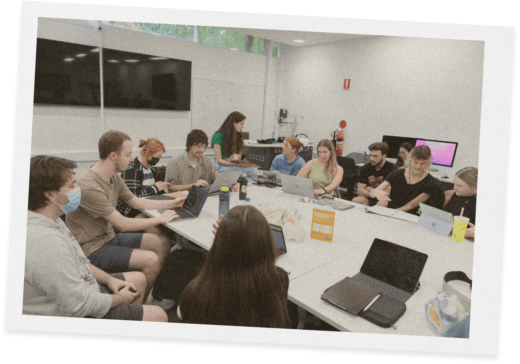 A photo of the grad show team working together